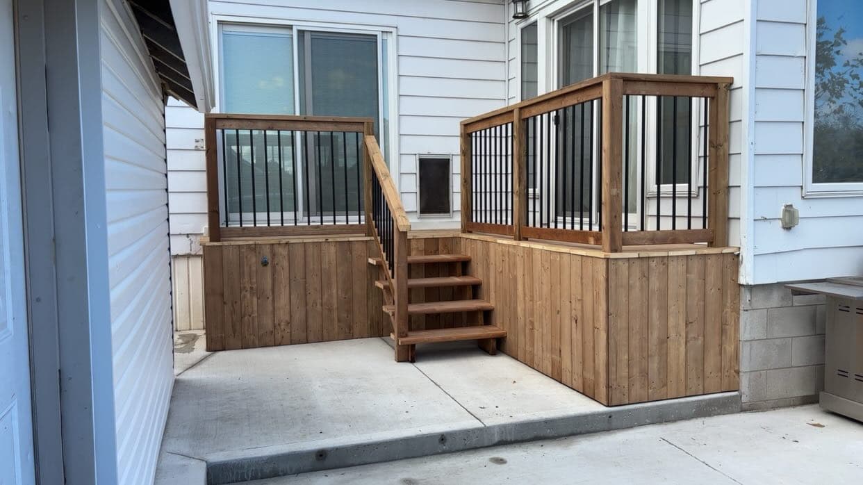 Wood deck with metal balusters and stairs