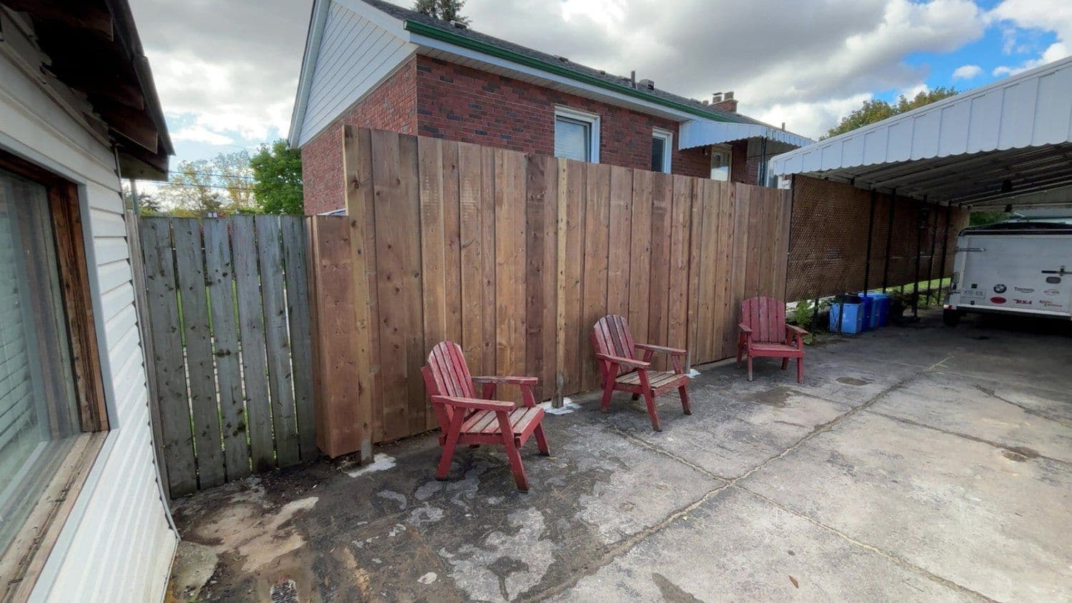Privacy fence build along brick exterior