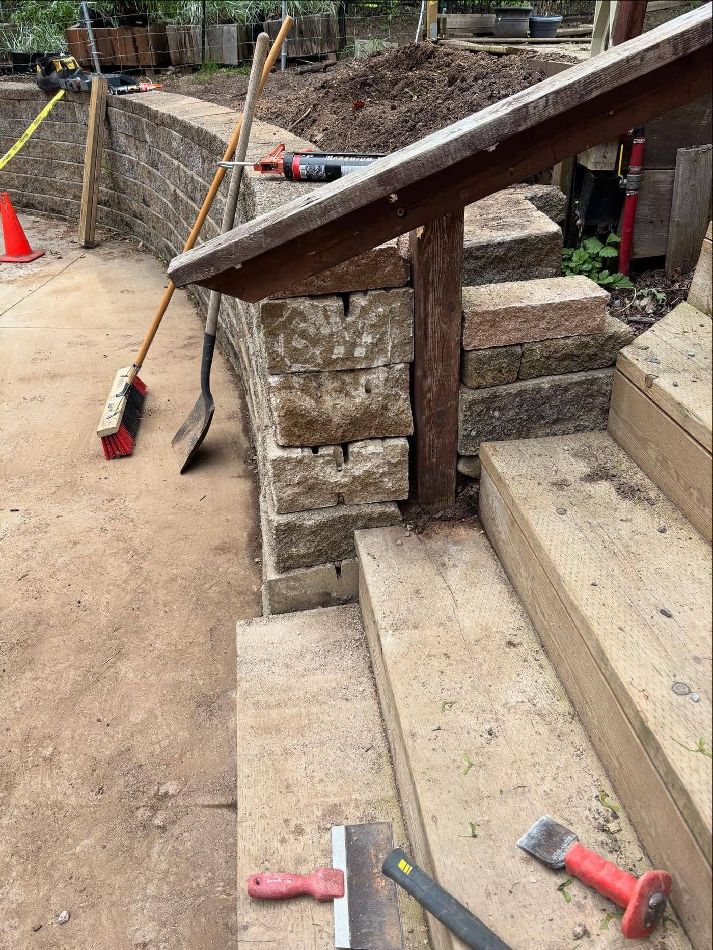 Stone retaining wall with timber stair landing
